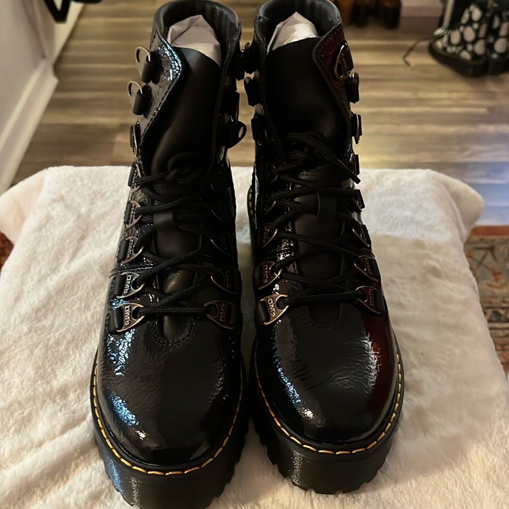LAURENNE DISTRESSED PATENT LEATHER LACE UP HEEL BOOTS. Top box has oil marks